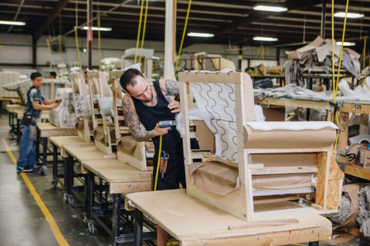 Fusion Furniture employee assembling chair