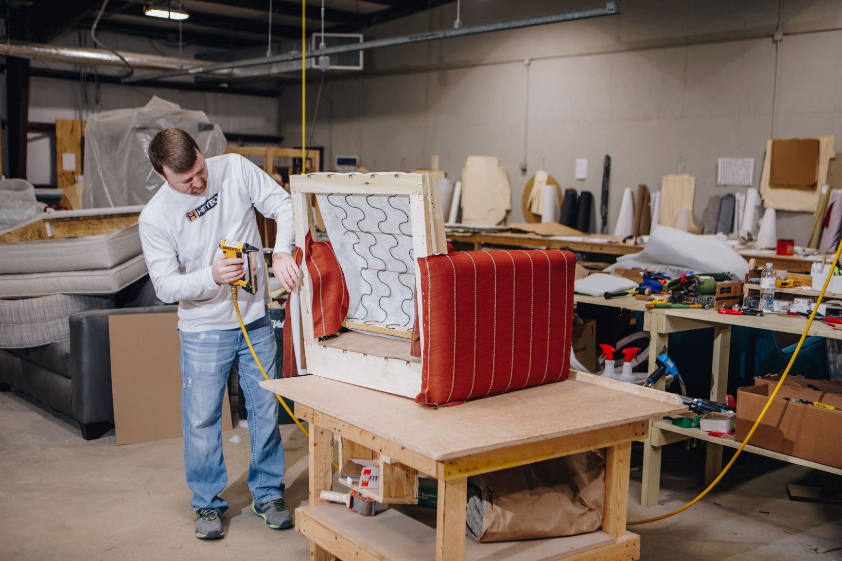 Fusion Furniture employee building a new product