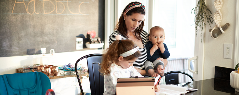 Mother with children in classroom at home