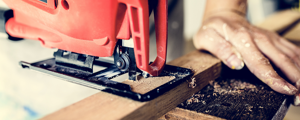 Man using tools for DIY practical woodworking project