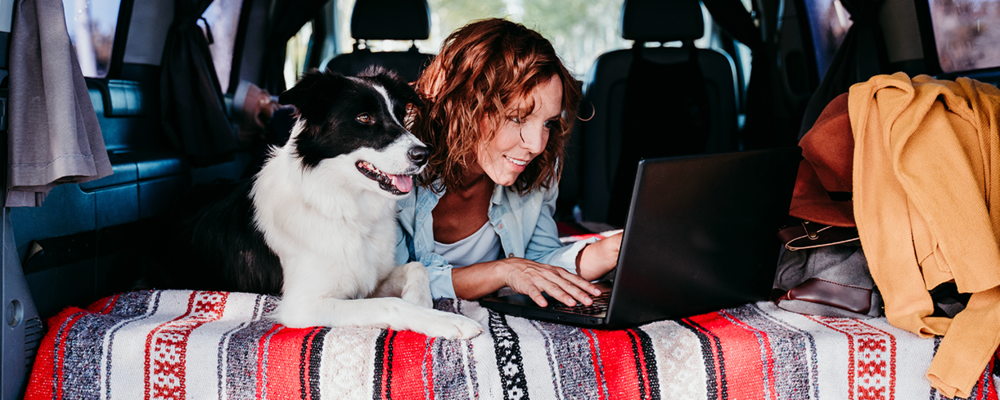 Woman laying on bed in travel van