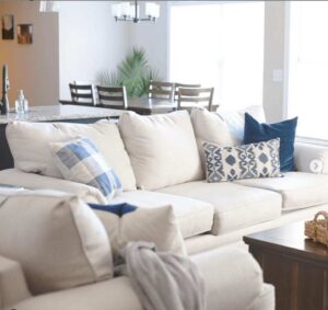White Fusion Furniture sofa and chair decorated with blue pillows
