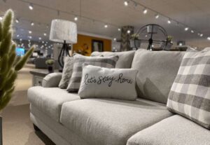 Fusion Furniture sofa and throw pillows in retailer showroom
