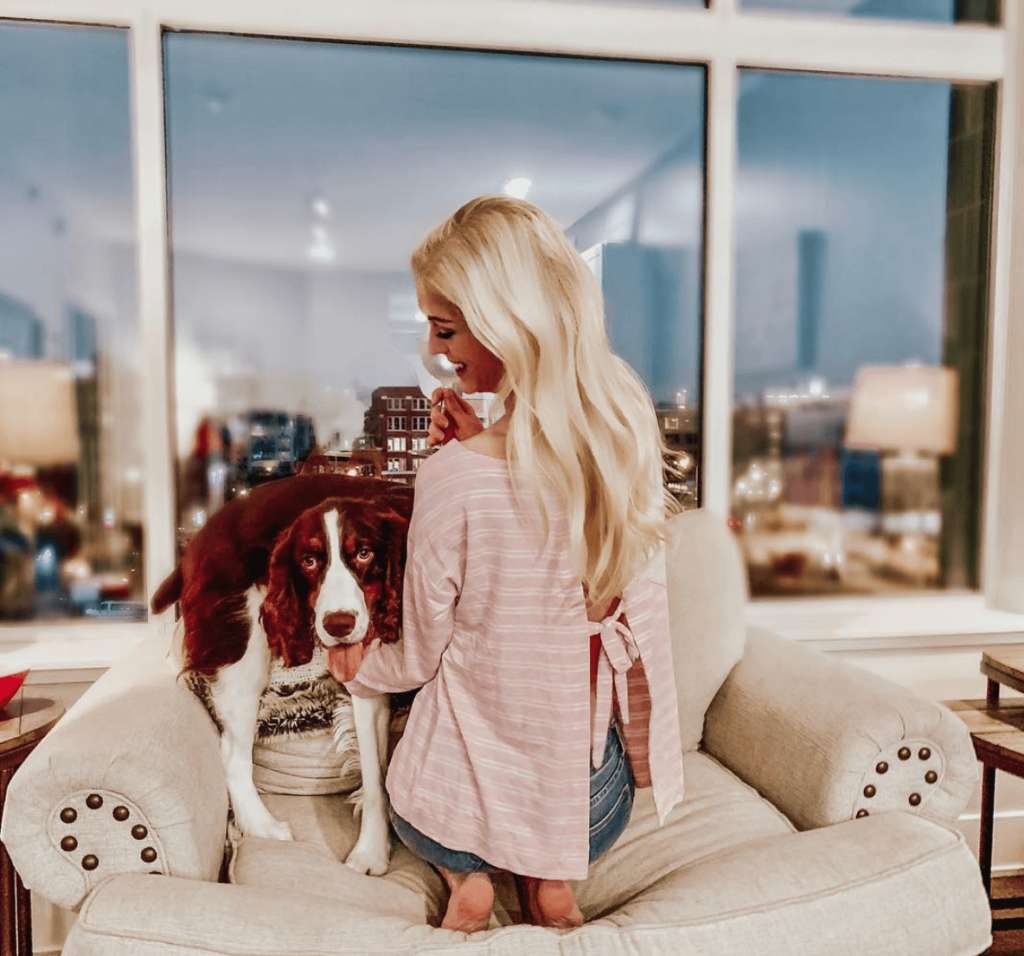 Girl and her dog enjoying a Fusion Furniture chair together