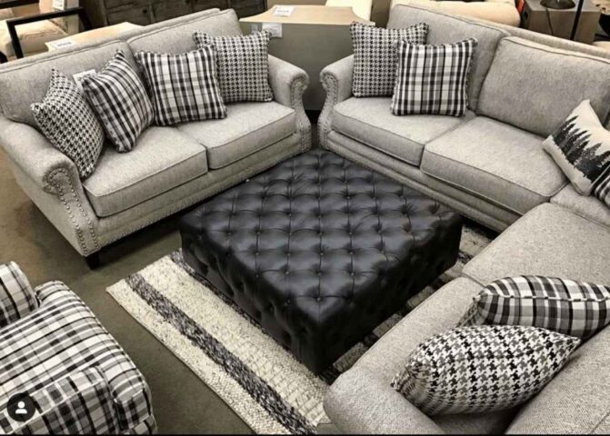 Grey Fusion Furniture sectional, sofa, ottoman and chair in retailer showroom