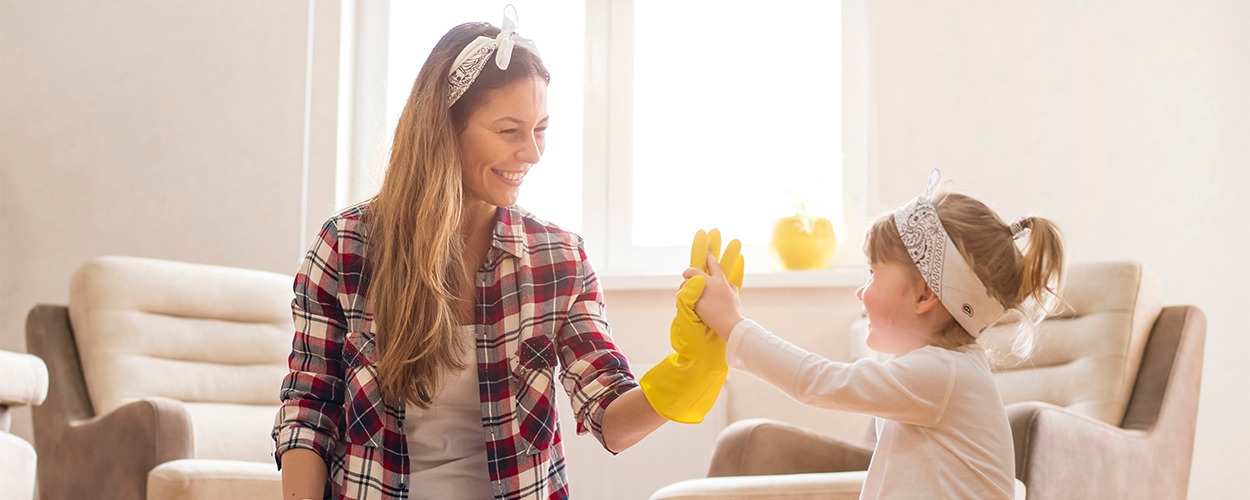 Mom and daughter working on home cleaning checklist